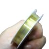 Close-up image of 0.3mm 15m gold-plated copper wire neatly coiled, showcasing its smooth, shiny finish and flexibility for jewelry making.