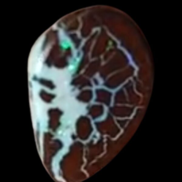A close-up image of a vibrant Boulder Opal, showcasing its striking play of color with rich blues, greens, and fiery oranges. The stone's natural matrix of dark brown and black rock contrasts beautifully with the bright iridescent hues, highlighting its unique, organic texture., showcasing its striking play of color with rich blues, greens, and fiery oranges. The stone's natural matrix of dark brown and black rock contrasts beautifully with the bright iridescent hues, highlighting its unique, organic texture.