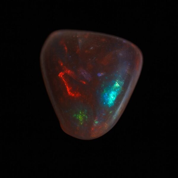 image is of a boulder opal with bright green, blue and red flecks