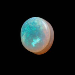 Image is of a opal doublet with blue and pink hue