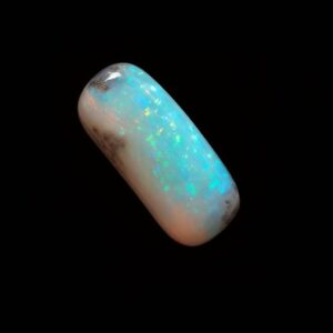 image is of a solid boulder opal with sparkles and blue hue