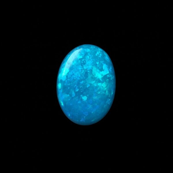 Image is of a boulder opal doublet with bright blue hues