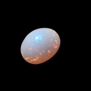 Image is of a boulder opal with vibrant red flecks