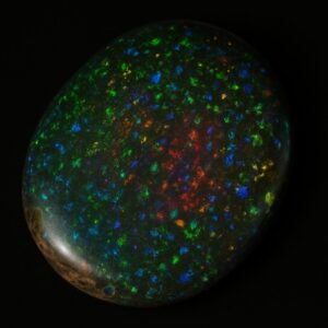 Image is of a solid boulder opal with vibrant rainbow flecks