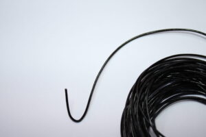 Close-up image of 3mm 5m Brown leather cord neatly coiled, highlighting its smooth texture, durability, and genuine leather quality, perfect for jewelry making and crafting.