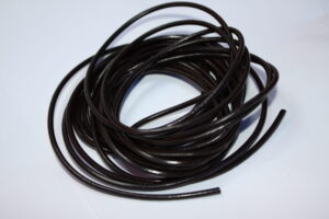 Close-up image of 3mm 5m Dark Brown leather cord neatly coiled, highlighting its smooth texture, durability, and genuine leather quality, perfect for jewelry making and crafting.