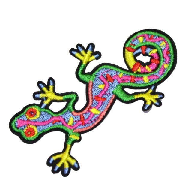 A rainbow ghecko embroided iron on patch, perfect for personalizing clothing, bags, and accessories. Easy to apply with heat, adding a retro touch to any project.