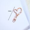 Close-up image of 10PCS swivel heart gold Lobster Swivel Clasp Hooks, showcasing their durable metal alloy construction, gold finish, and 360-degree swivel design.