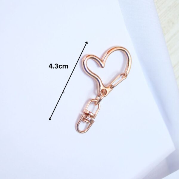 Close-up image of 10PCS swivel heart gold Lobster Swivel Clasp Hooks, showcasing their durable metal alloy construction, gold finish, and 360-degree swivel design.