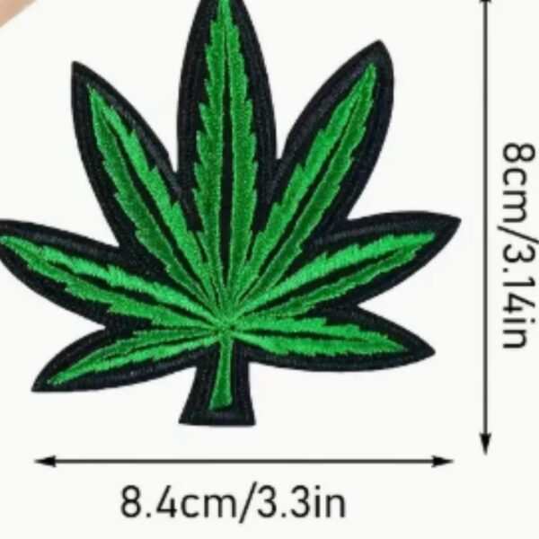A Marijuana embroided iron on patch, perfect for personalizing clothing, bags, and accessories. Easy to apply with heat, adding a retro touch to any project.