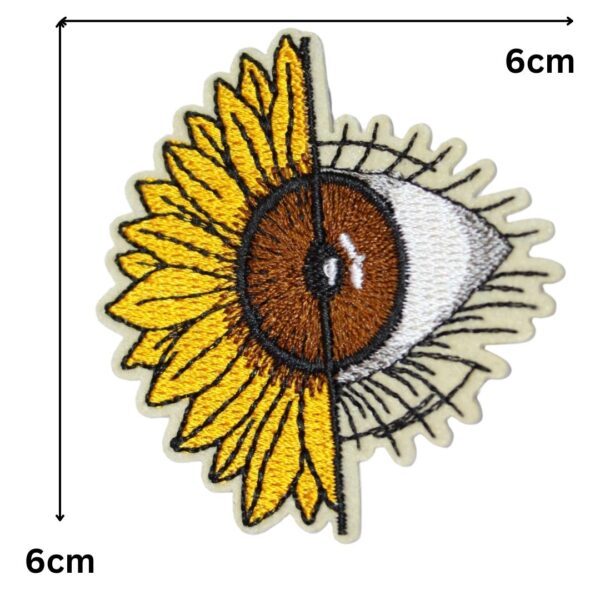 A SUNFLOWER EYE embroided iron on patch, perfect for personalizing clothing, bags, and accessories. Easy to apply with heat, adding a retro touch to any project.