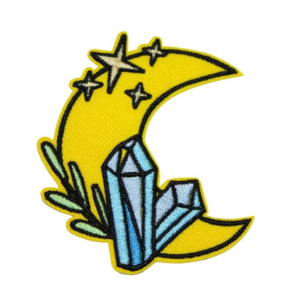A CRYSTAL MOON embroided iron on patch, perfect for personalizing clothing, bags, and accessories. Easy to apply with heat, adding a retro touch to any project.