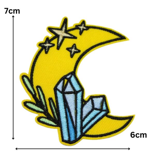 A CRYSTAL MOON embroided iron on patch, perfect for personalizing clothing, bags, and accessories. Easy to apply with heat, adding a retro touch to any project.