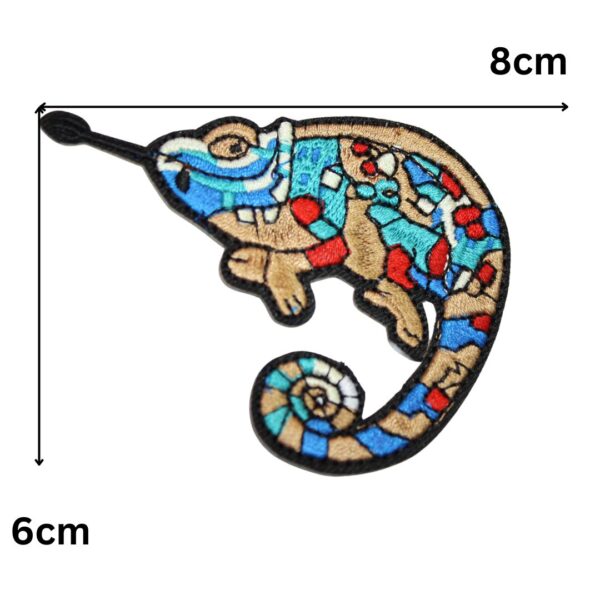 A rainbow ghecko embroided iron on patch, perfect for personalizing clothing, bags, and accessories. Easy to apply with heat, adding a retro touch to any project.