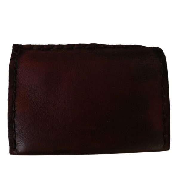 Image is of a leather embossed tobacco pouch with an embossed triquetra knot on it