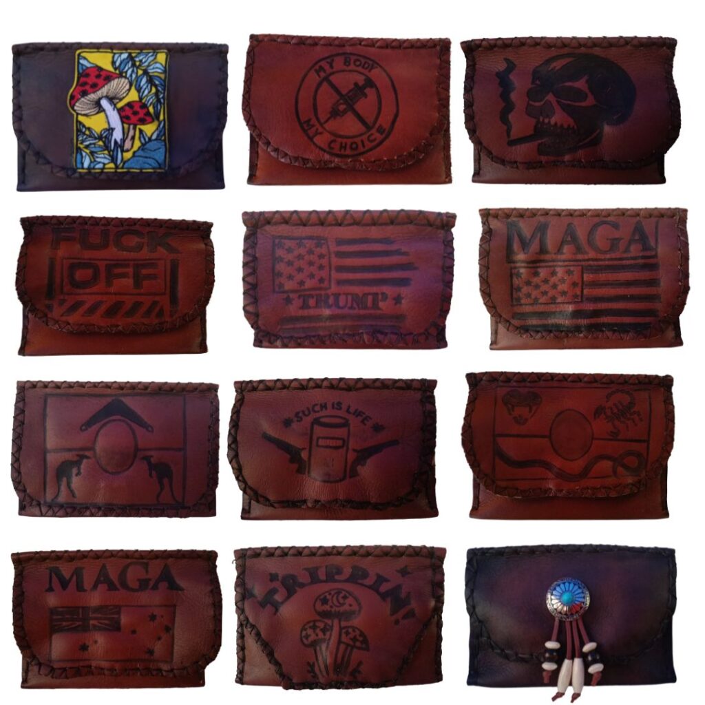 Image is of a lot of embossed leather tobacco pouches with various designs 